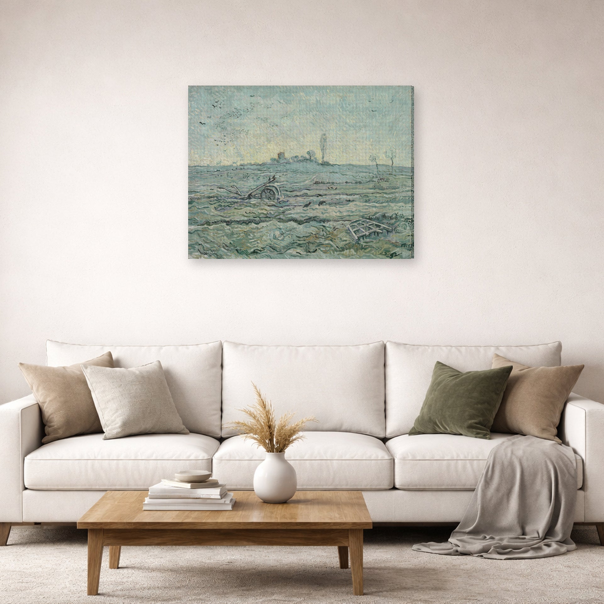 Gallery-wrapped canvas print of Vincent van Gogh's Snow Covered Field with a Harrow (after Millet) displayed on a wall in a living room