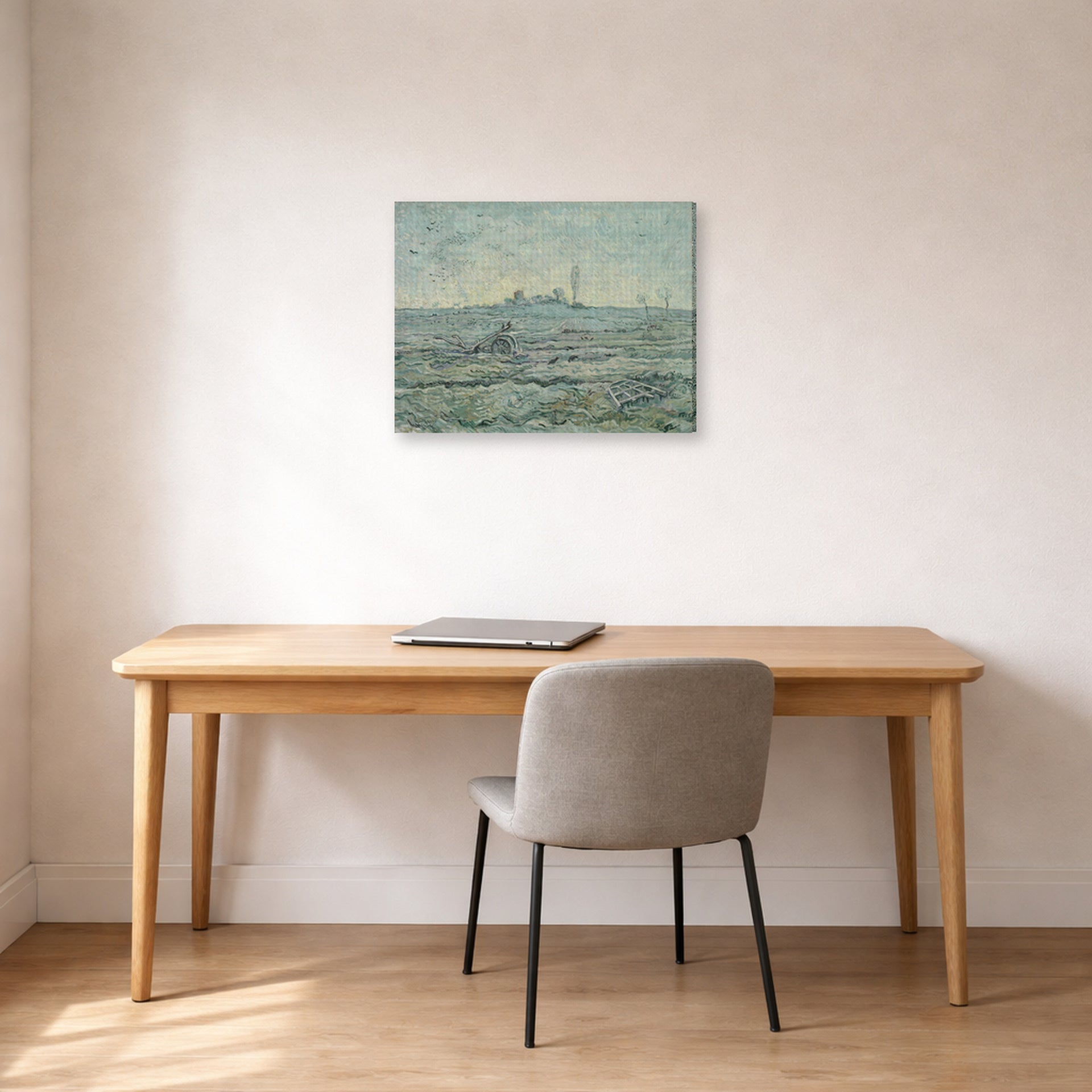 Gallery-wrapped canvas print of Vincent van Gogh's Snow Covered Field with a Harrow (after Millet) displayed on a wall in a home office