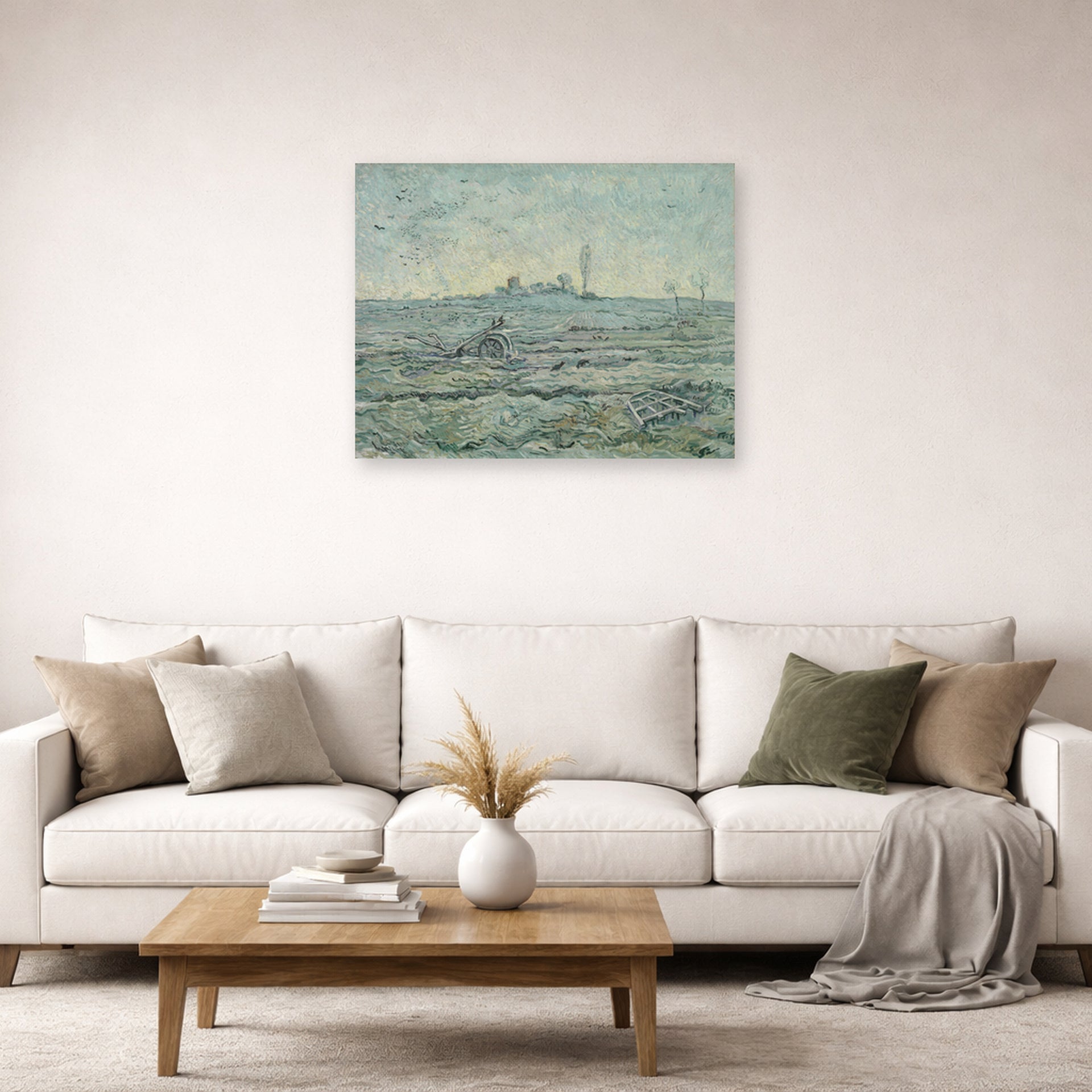 Unframed poster print of Vincent van Gogh's Snow Covered Field with a Harrow (after Millet) displayed on a wall in a living room