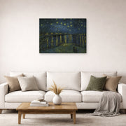 Gallery-wrapped canvas print of Vincent van Gogh's Starry Night displayed on a wall in a living room