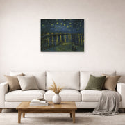 Unframed poster print of Vincent van Gogh's Starry Night displayed on a wall in a living room