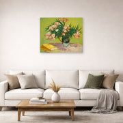 Unframed poster print of Vincent van Gogh's Still Life Vase with Oleanders and Books displayed on a wall in a living room