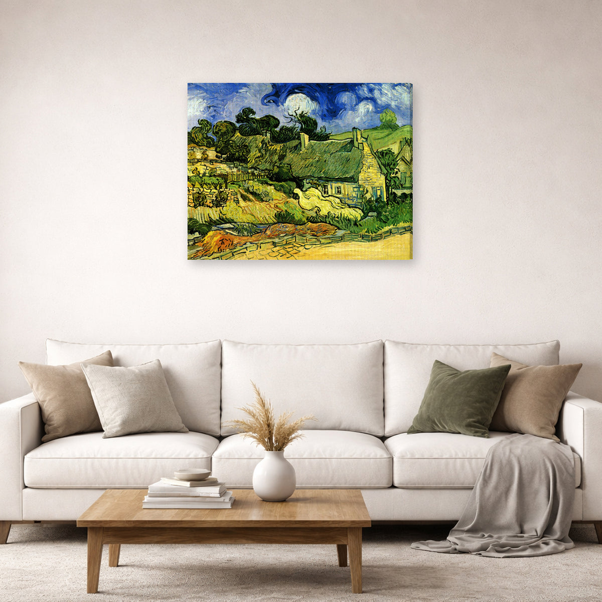 Gallery-wrapped canvas print of Vincent van Gogh's Thatched Cottages at Cordeville displayed on a wall in a living room