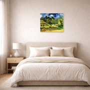 Unframed poster print of Vincent van Gogh's Thatched Cottages at Cordeville displayed on a wall in a bedroom