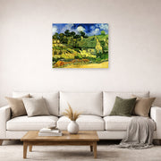 Unframed poster print of Vincent van Gogh's Thatched Cottages at Cordeville displayed on a wall in a living room