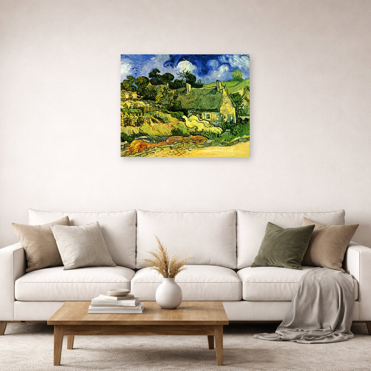 Unframed poster print of Vincent van Gogh's Thatched Cottages at Cordeville displayed on a wall in a living room