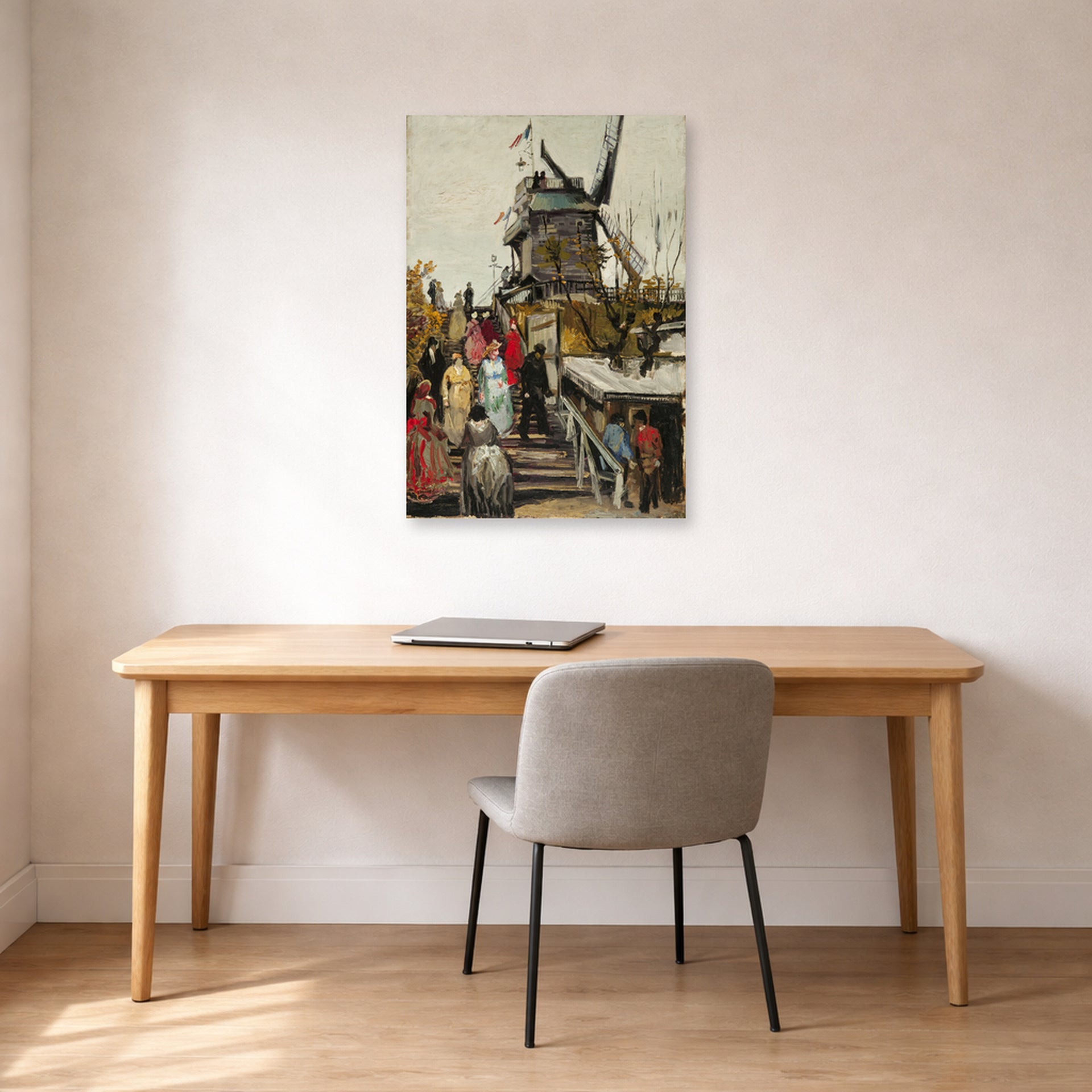 Unframed poster print of Vincent van Gogh's The Blute Fin Windmill displayed on a wall in a home office