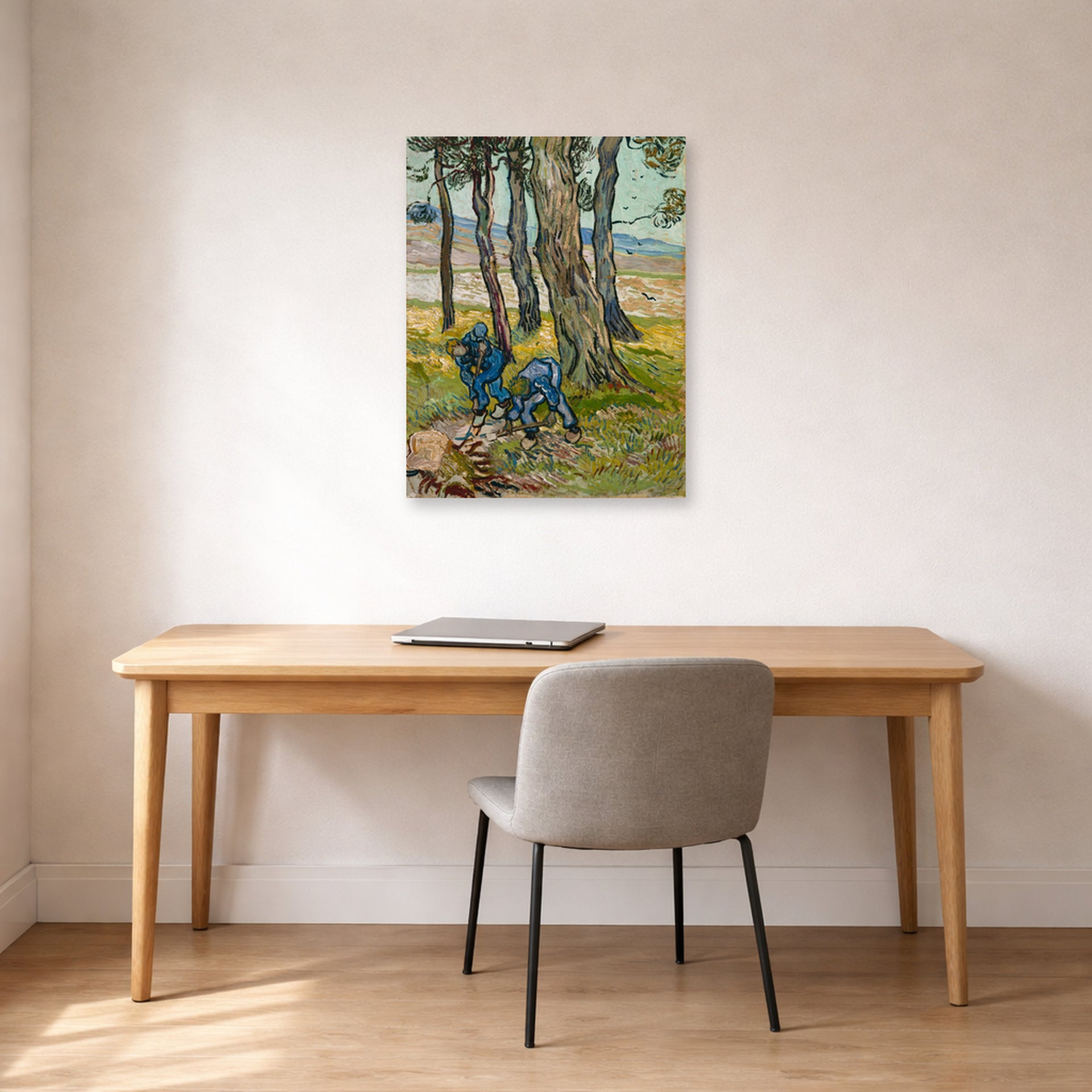 Unframed poster print of Vincent van Gogh's The Diggers displayed on a wall in a home office