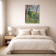 Gallery-wrapped canvas print of Vincent van Gogh's The Garden of Saint Paul Hospital displayed on a wall in a bedroom