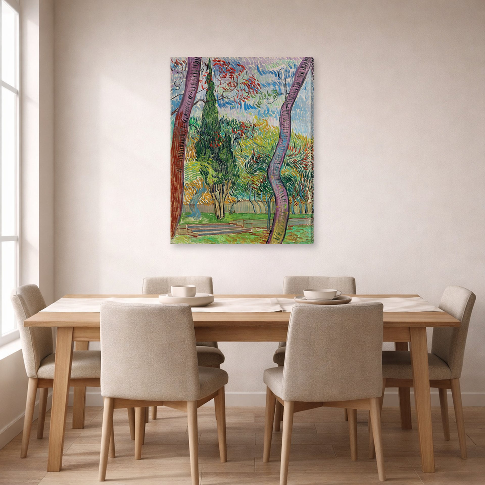 Gallery-wrapped canvas print of Vincent van Gogh's The Garden of Saint Paul Hospital displayed on a wall in a dining room