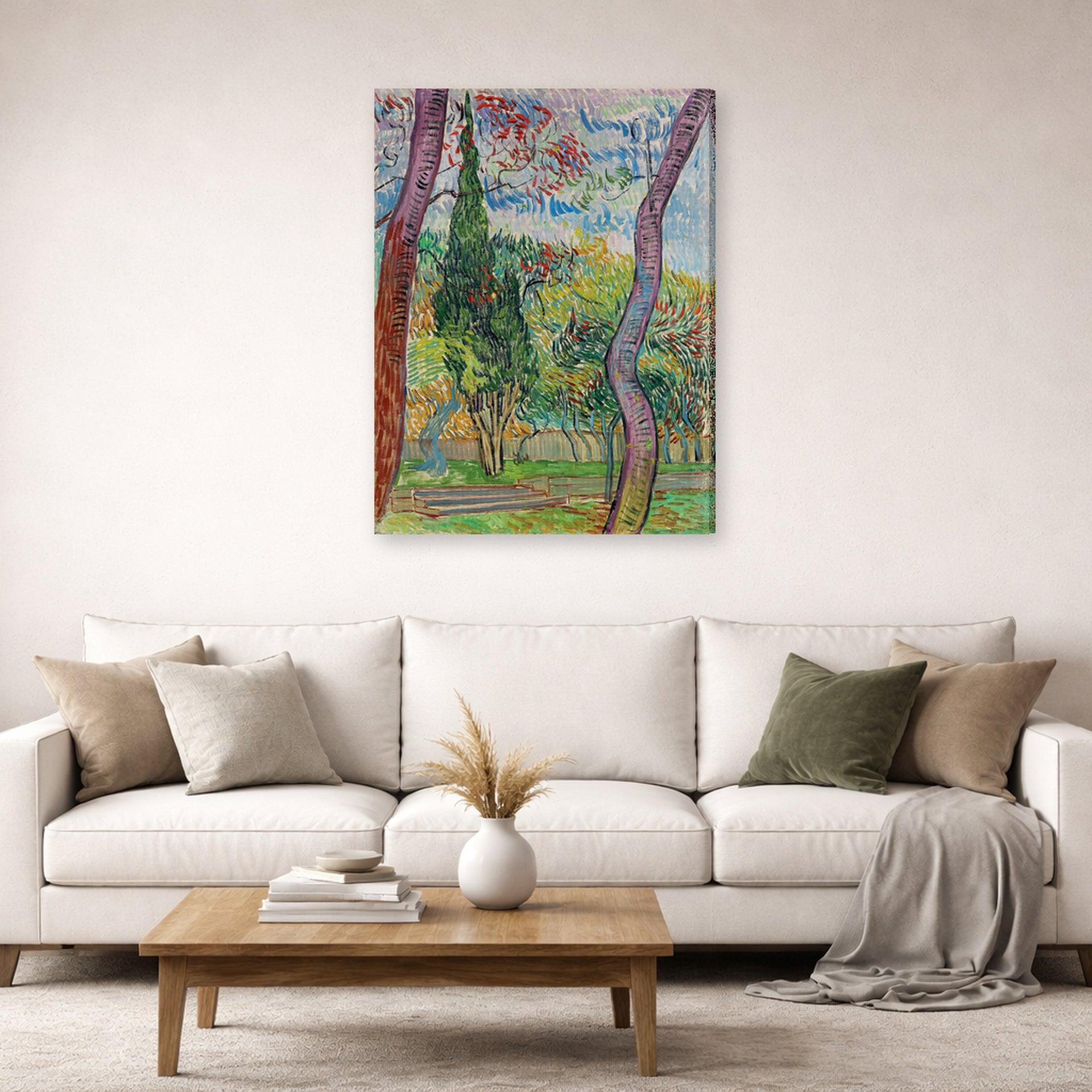 Gallery-wrapped canvas print of Vincent van Gogh's The Garden of Saint Paul Hospital displayed on a wall in a living room