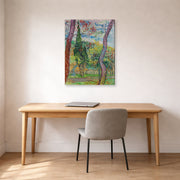 Gallery-wrapped canvas print of Vincent van Gogh's The Garden of Saint Paul Hospital displayed on a wall in a home office