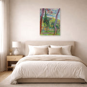 Unframed poster print of Vincent van Gogh's The Garden of Saint Paul Hospital displayed on a wall in a bedroom