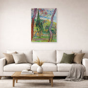 Unframed poster print of Vincent van Gogh's The Garden of Saint Paul Hospital displayed on a wall in a living room