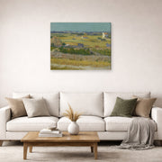 Gallery-wrapped canvas print of Vincent van Gogh's The Harvest displayed on a wall in a living room