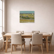 Unframed poster print of Vincent van Gogh's The Harvest displayed on a wall in a dining room
