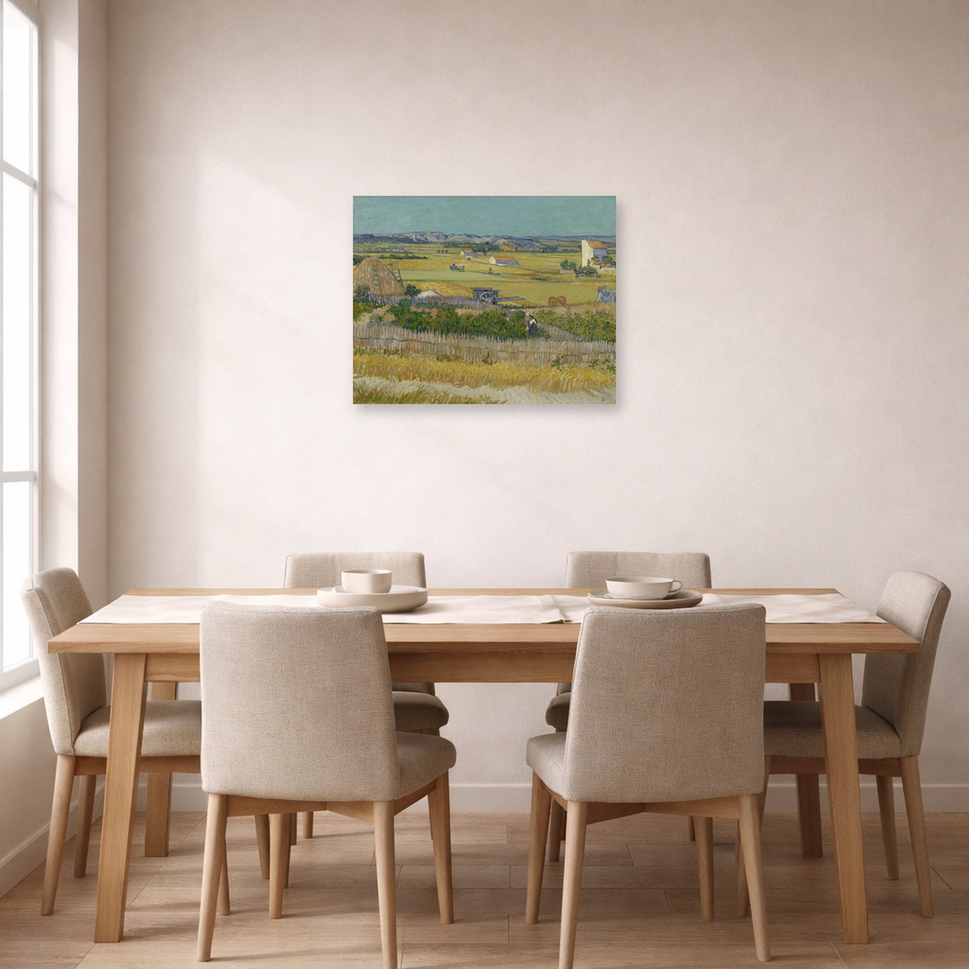 Unframed poster print of Vincent van Gogh's The Harvest displayed on a wall in a dining room