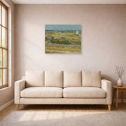 Unframed poster print of Vincent van Gogh's The Harvest displayed on a wall in a living room