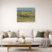 Unframed poster print of Vincent van Gogh's The Harvest displayed on a wall in a living room