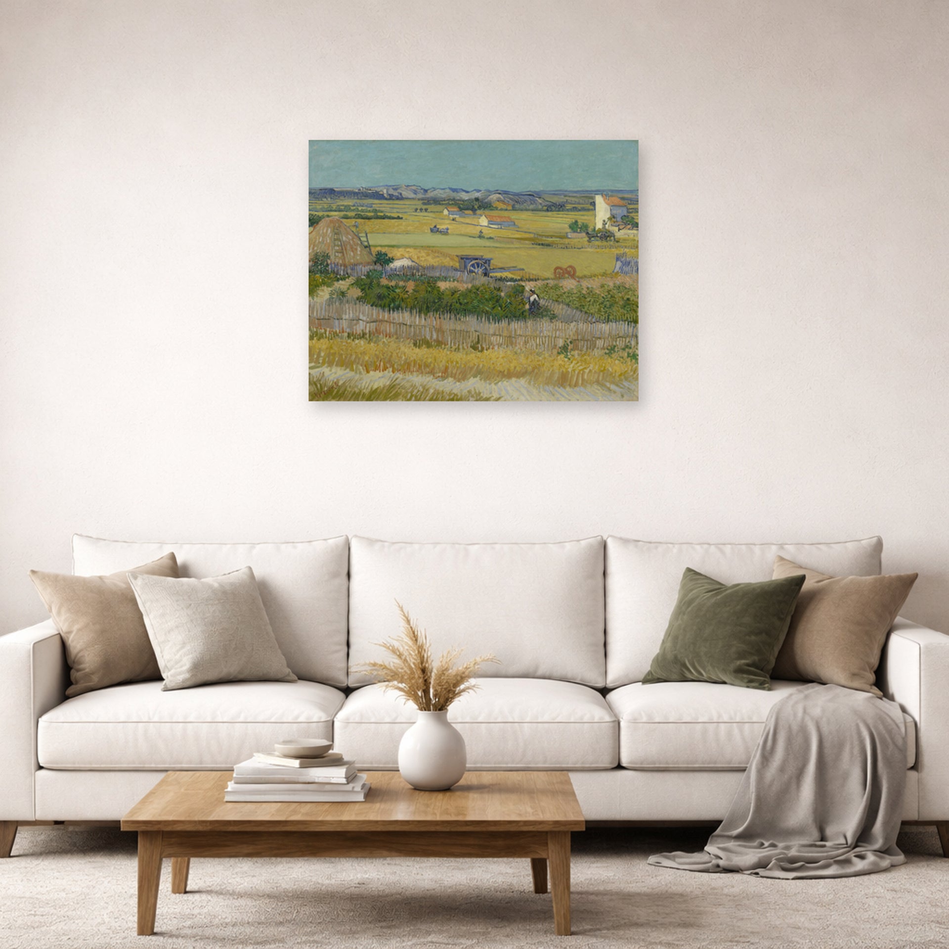 Unframed poster print of Vincent van Gogh's The Harvest displayed on a wall in a living room