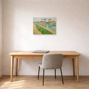 Unframed poster print of Vincent van Gogh's The Langlois Bridge displayed on a wall in a home office
