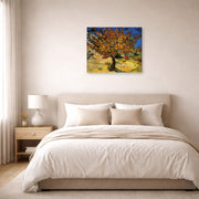 Gallery-wrapped canvas print of Vincent van Gogh's The Mulberry Tree displayed on a wall in a bedroom