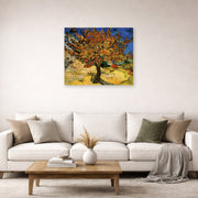 Unframed poster print of Vincent van Gogh's The Mulberry Tree displayed on a wall in a living room