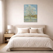 Gallery-wrapped canvas print of Vincent van Gogh's The Pink Peach Tree displayed on a wall in a bedroom