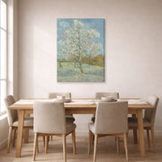 Gallery-wrapped canvas print of Vincent van Gogh's The Pink Peach Tree displayed on a wall in a dining room