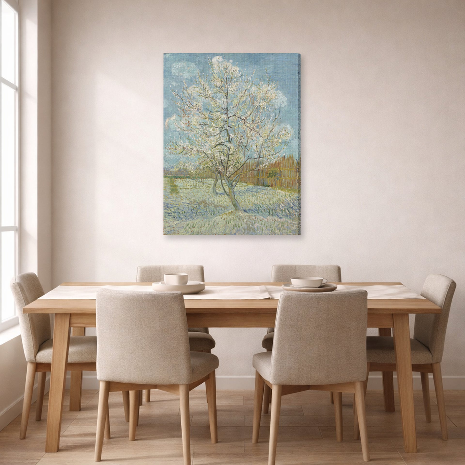 Gallery-wrapped canvas print of Vincent van Gogh's The Pink Peach Tree displayed on a wall in a dining room