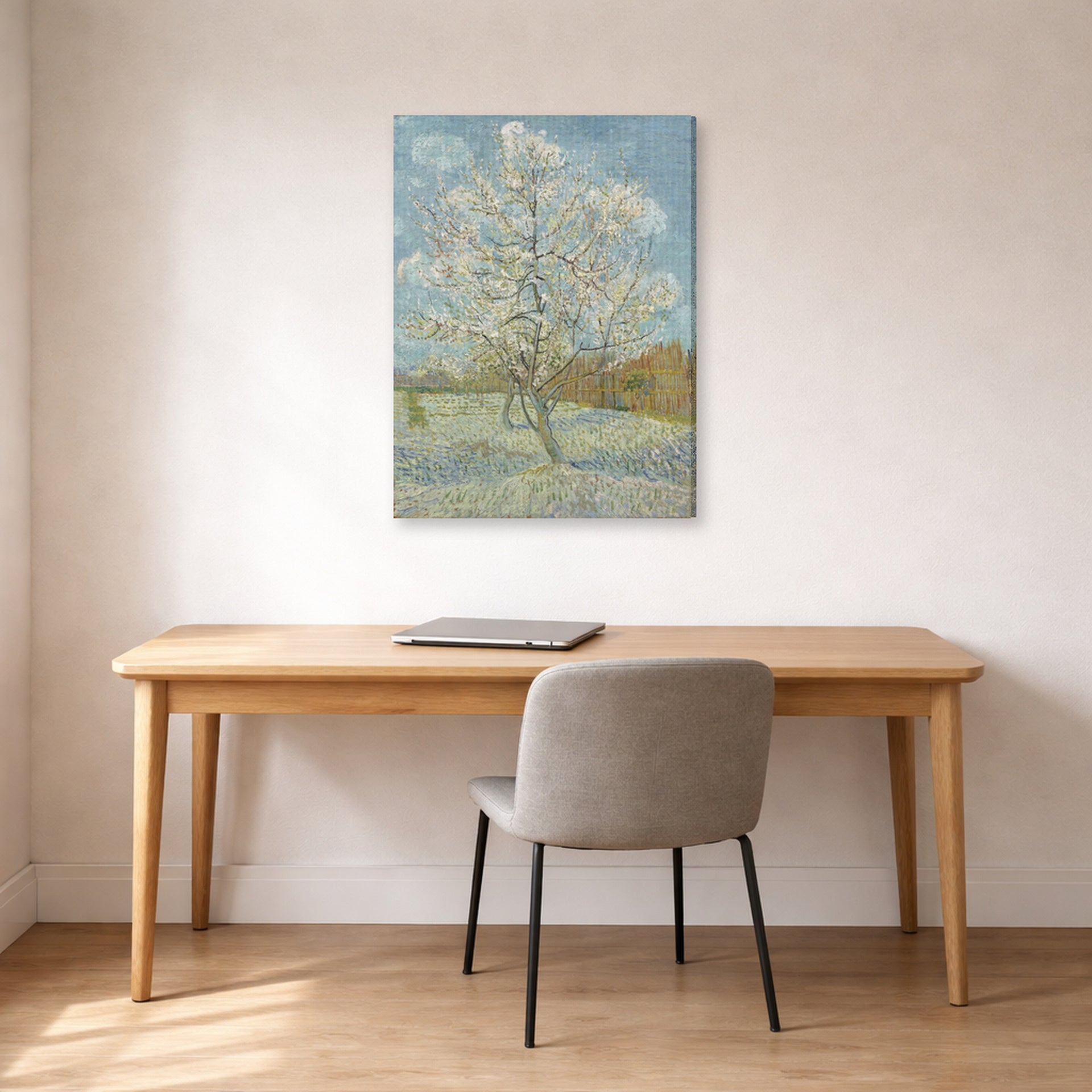Gallery-wrapped canvas print of Vincent van Gogh's The Pink Peach Tree displayed on a wall in a home office