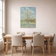 Unframed poster print of Vincent van Gogh's The Pink Peach Tree displayed on a wall in a dining room
