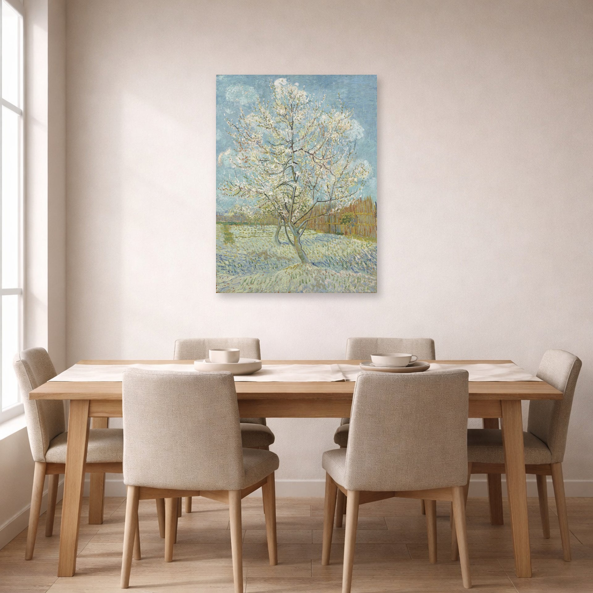 Unframed poster print of Vincent van Gogh's The Pink Peach Tree displayed on a wall in a dining room