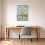 Unframed poster print of Vincent van Gogh's The Pink Peach Tree displayed on a wall in a home office