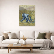Unframed poster print of Vincent van Gogh's The Reaper displayed on a wall in a living room