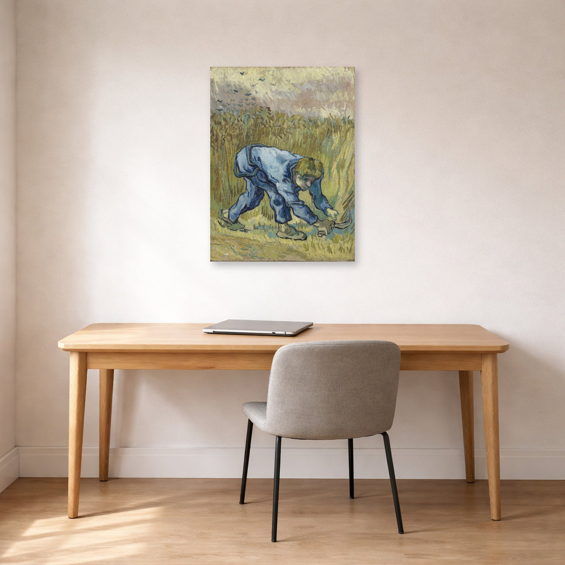 Unframed poster print of Vincent van Gogh's The Reaper displayed on a wall in a home office