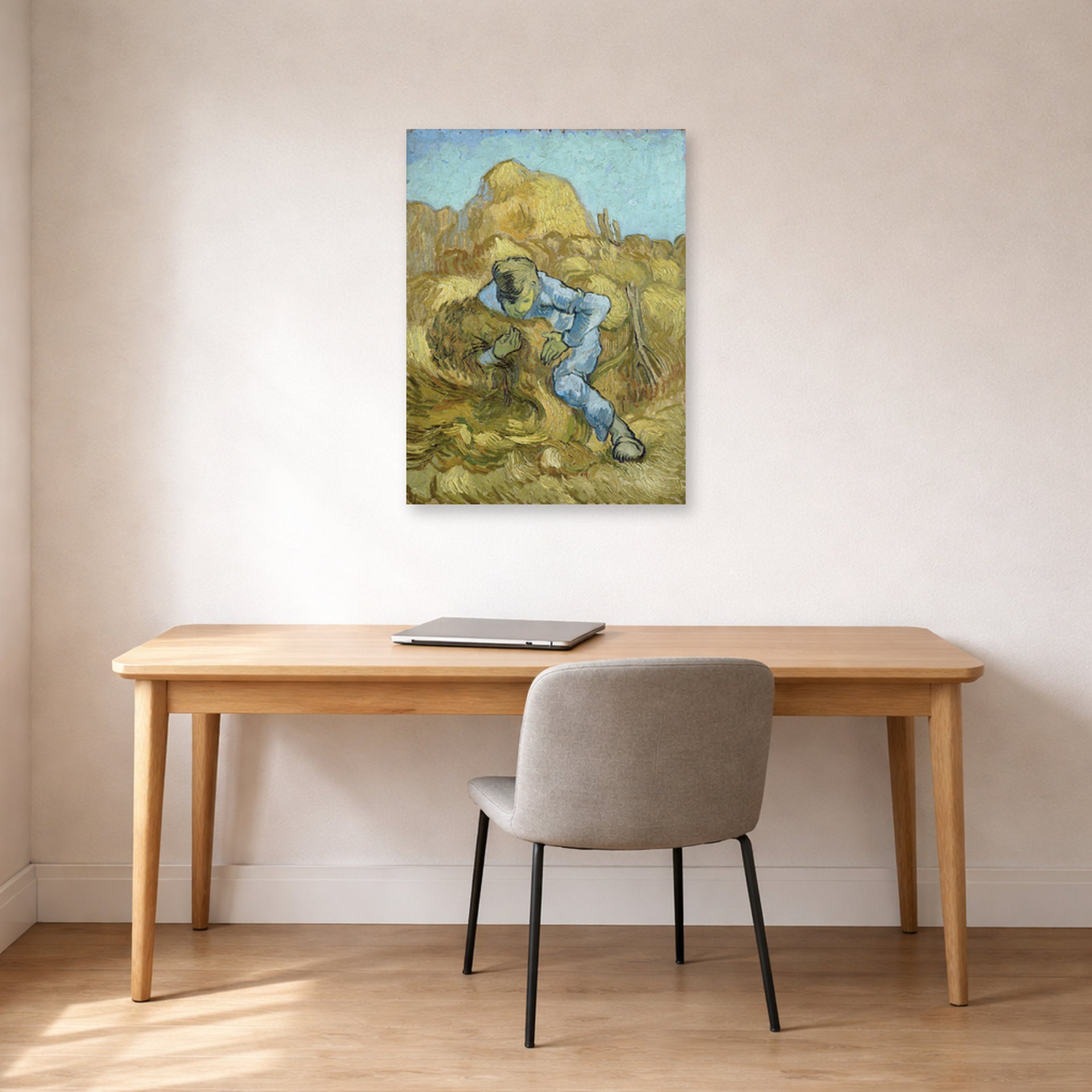 Unframed poster print of Vincent van Gogh's The Sheaf Binder displayed on a wall in a home office