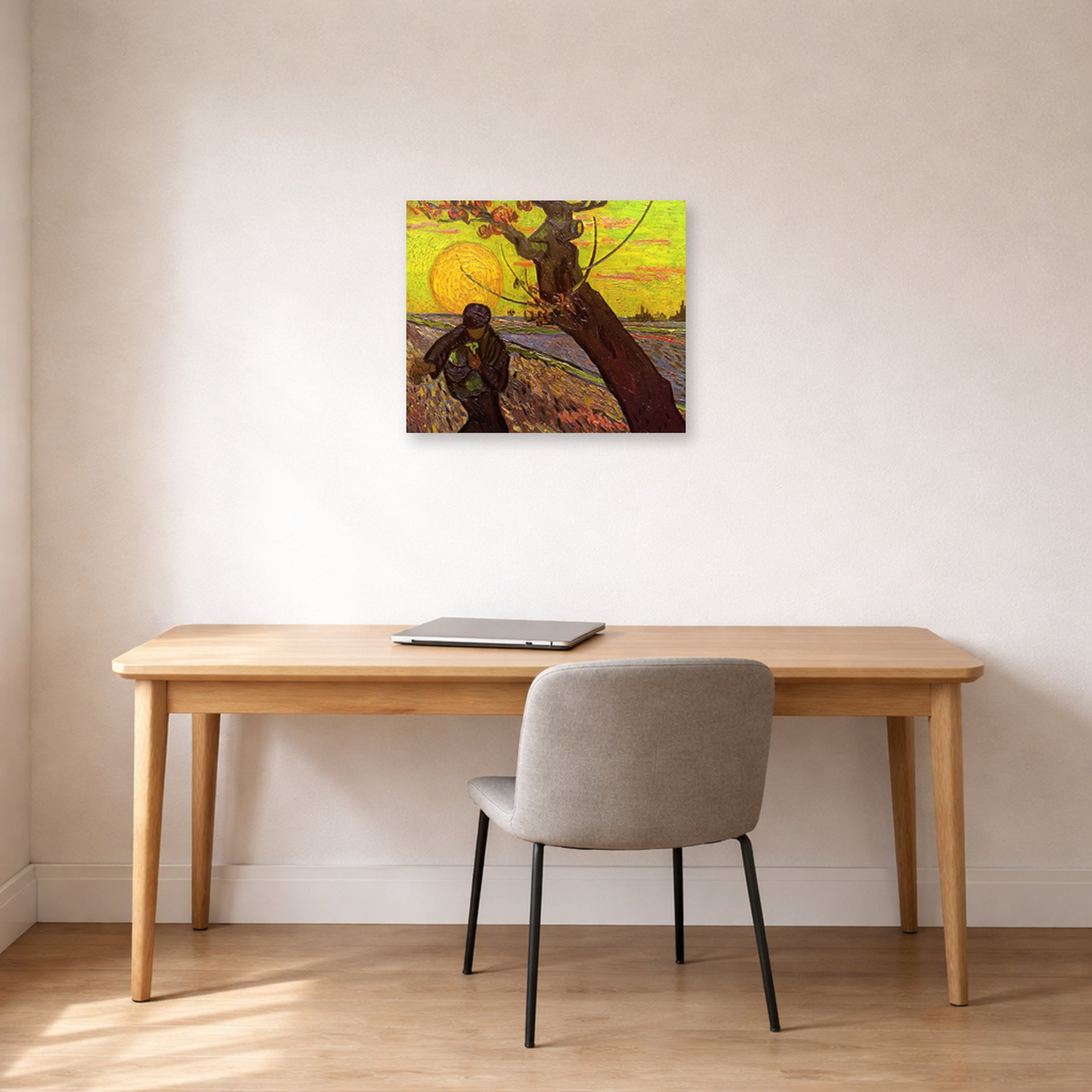 Unframed poster print of Vincent van Gogh's The Sower displayed on a wall in a home office