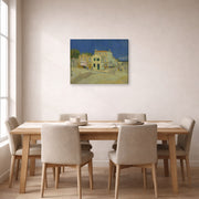 Gallery-wrapped canvas print of Vincent van Gogh's The Yellow House (the Street) displayed on a wall in a dining room