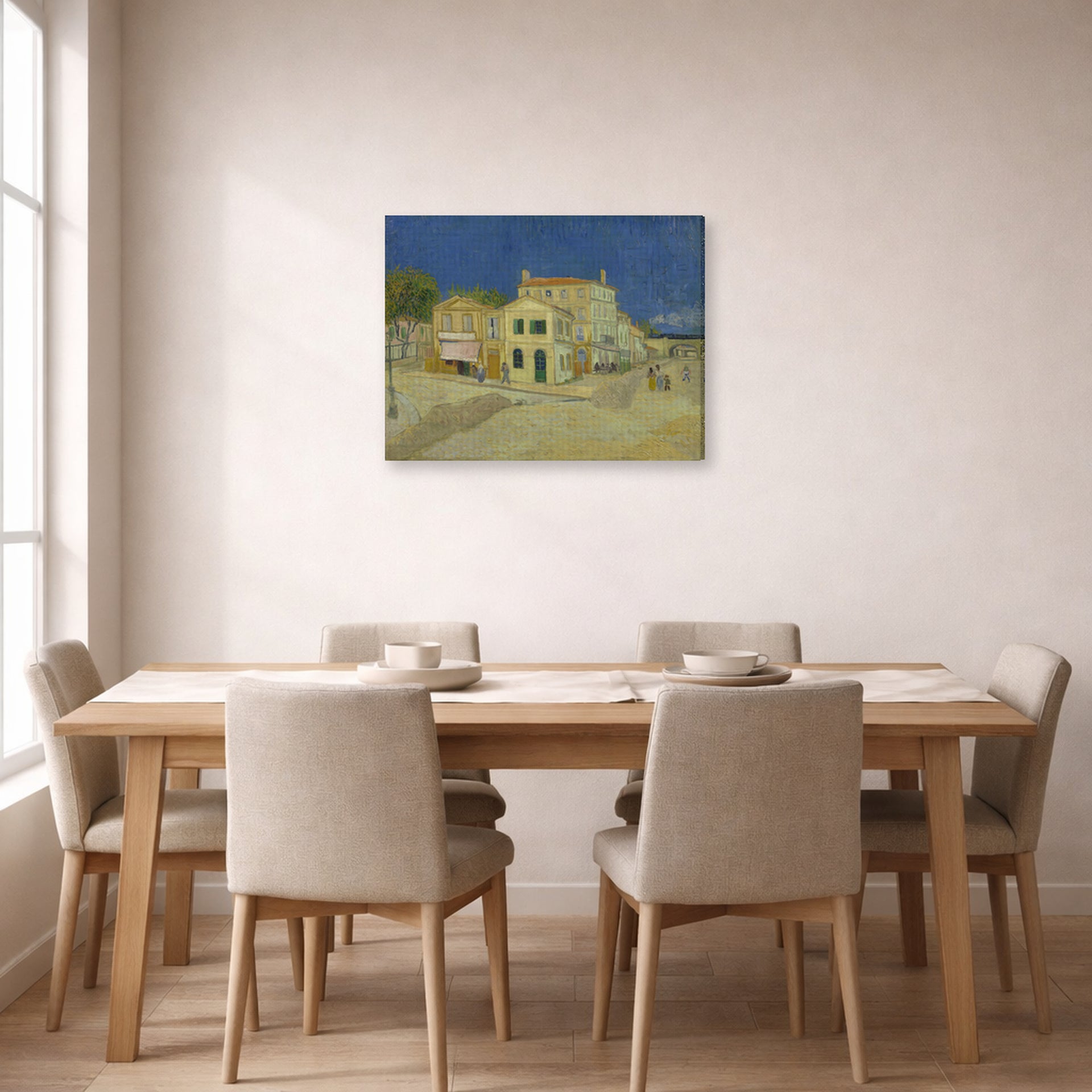 Gallery-wrapped canvas print of Vincent van Gogh's The Yellow House (the Street) displayed on a wall in a dining room