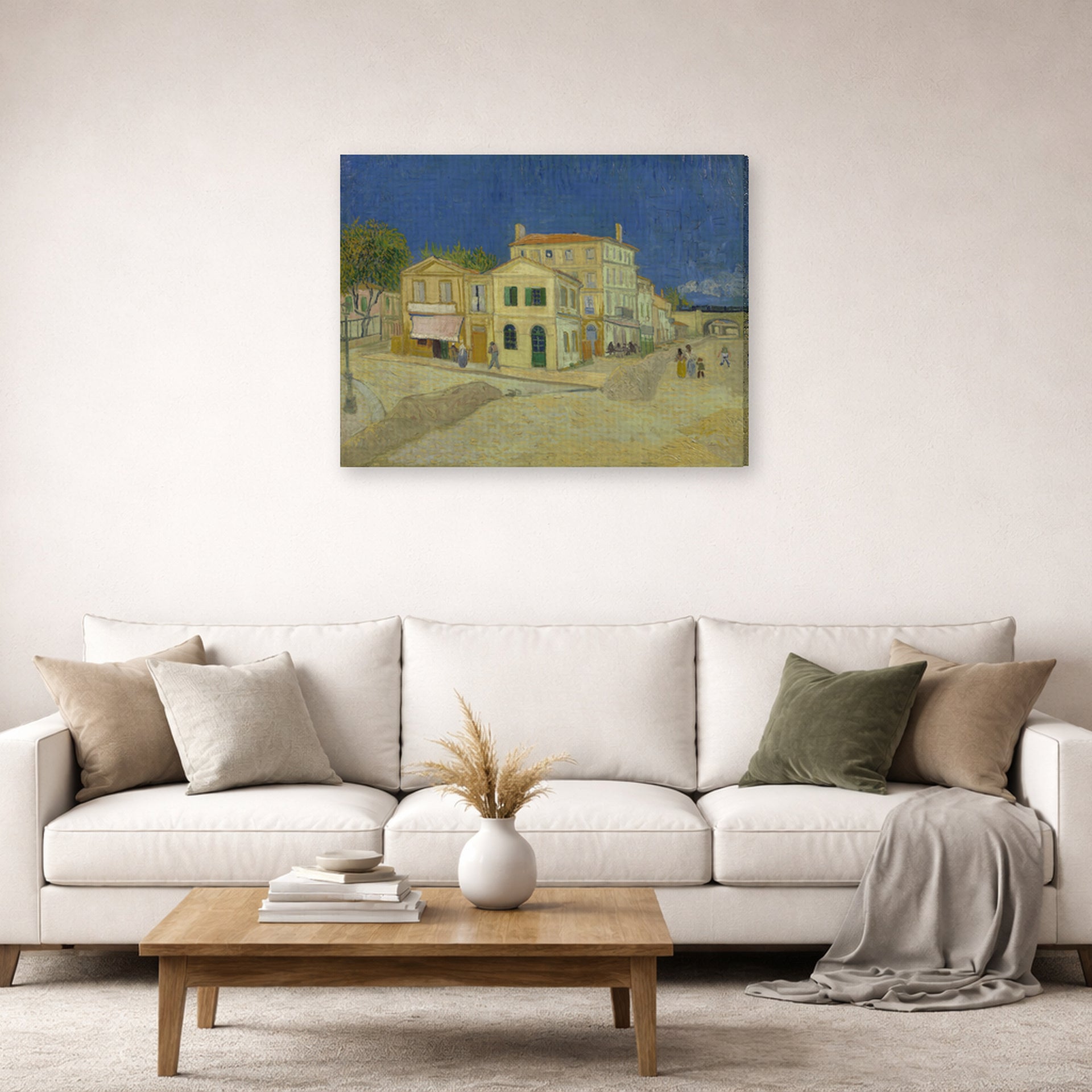 Gallery-wrapped canvas print of Vincent van Gogh's The Yellow House (the Street) displayed on a wall in a living room