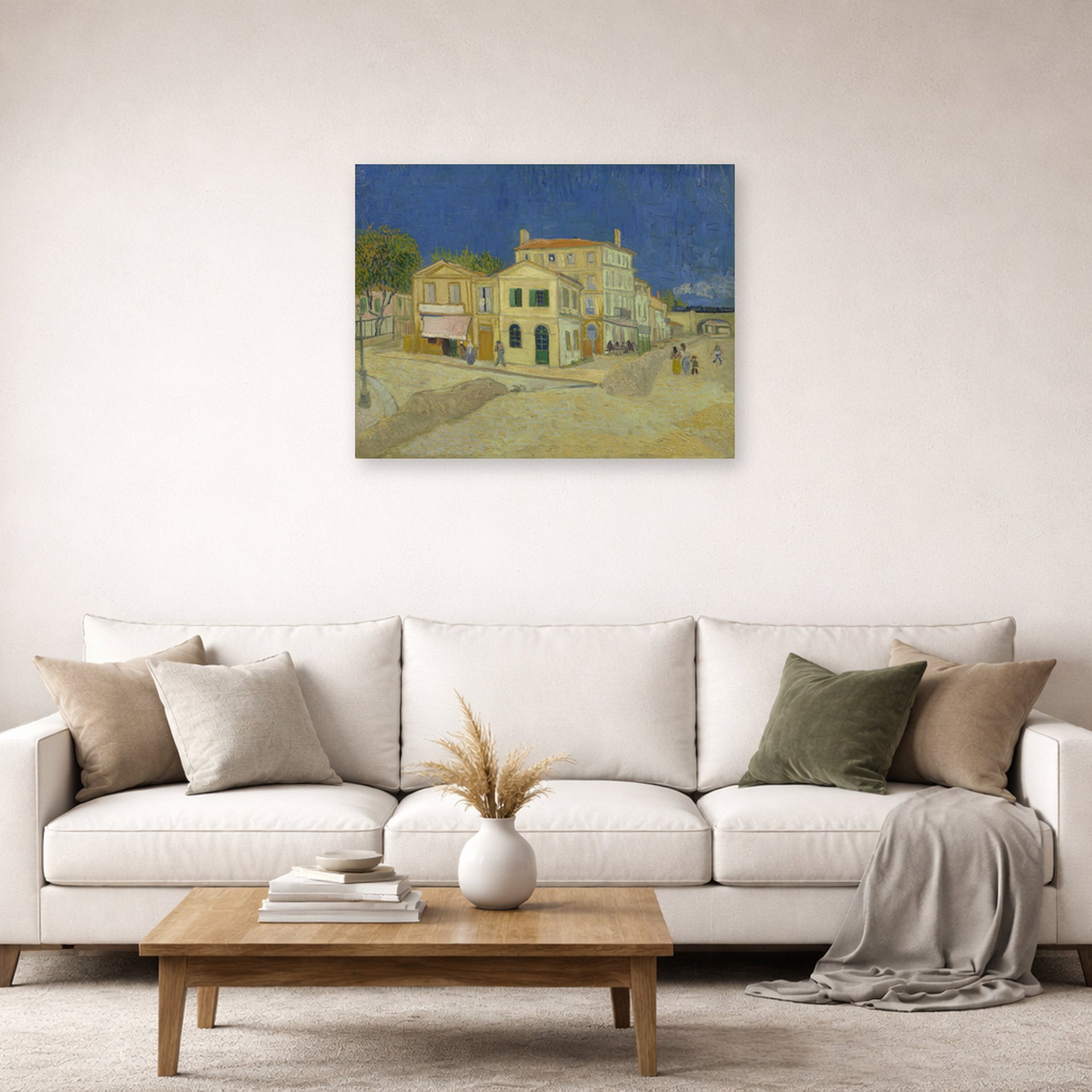Unframed poster print of Vincent van Gogh's The Yellow House (the Street) displayed on a wall in a living room