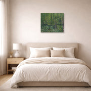 Unframed poster print of Vincent van Gogh's Trees and Undergrowth displayed on a wall in a bedroom