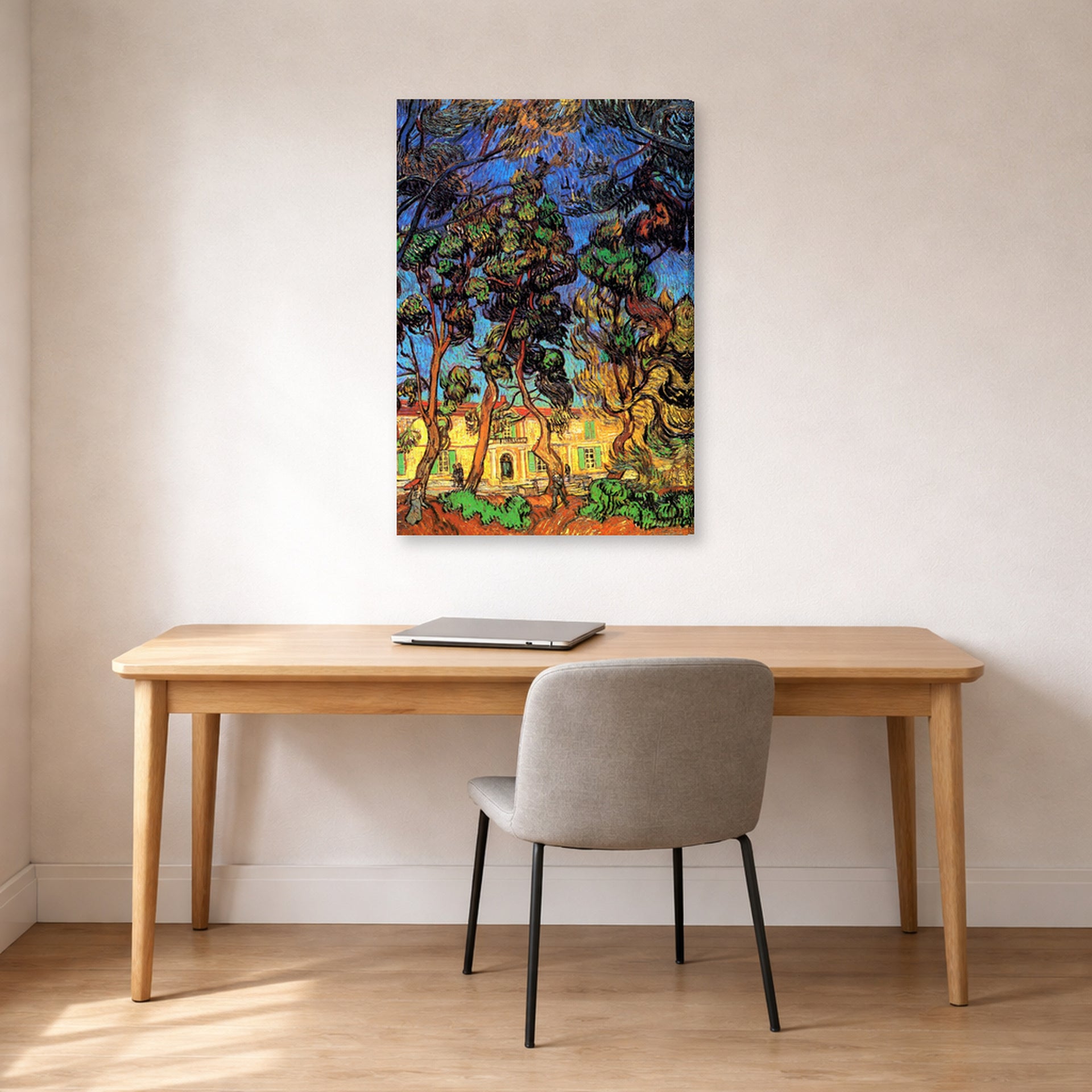 Gallery-wrapped canvas print of Vincent van Gogh's Trees in the Garden of Saint Paul Hospital displayed on a wall in a home office