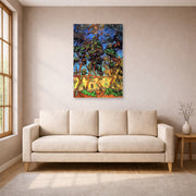 Unframed poster print of Vincent van Gogh's Trees in the Garden of Saint Paul Hospital displayed on a wall in a living room