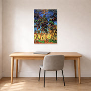 Unframed poster print of Vincent van Gogh's Trees in the Garden of Saint Paul Hospital displayed on a wall in a home office