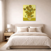 Unframed poster print of Vincent van Gogh's Vase with Fifteen Sunflowers displayed on a wall in a bedroom