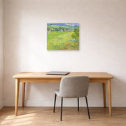 Unframed poster print of Vincent van Gogh's View of Vessenots Near Auvers displayed on a wall in a home office