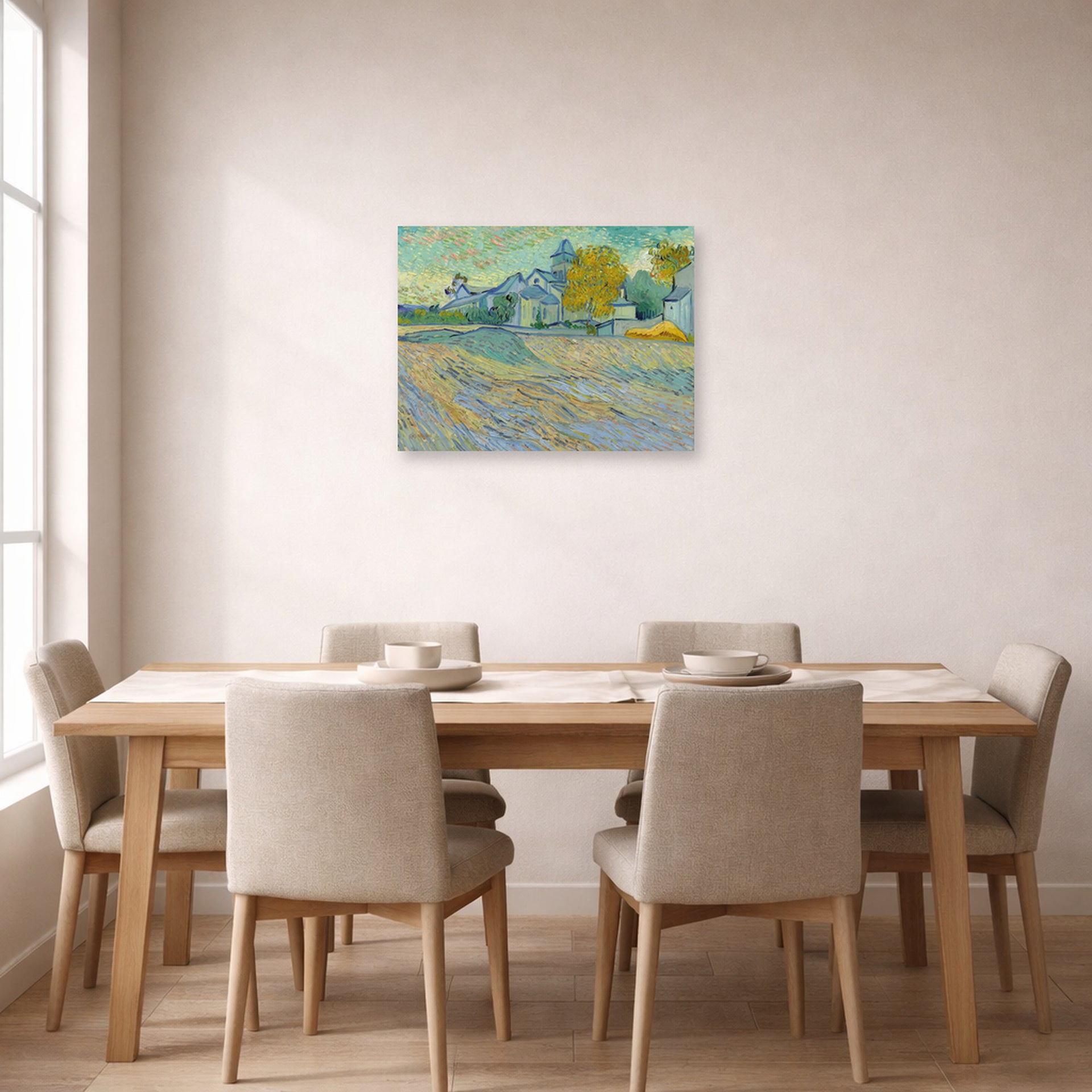 Unframed poster print of Vincent van Gogh's View of the Asylum and Chapel at Saint Remy displayed on a wall in a dining room
