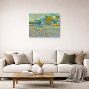 Unframed poster print of Vincent van Gogh's View of the Asylum and Chapel at Saint Remy displayed on a wall in a living room